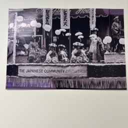 Display of a photo of a Japanese community celebration.