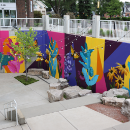 The Friends of St. Charles Public Library commissioned two local artists to create a mural on the outside walls of the Library's terrace garden. A dedication ceremony was held upon completion, where patrons and guests could view the beautiful, vibrant design (as well as tribute plaques with names of loved ones).