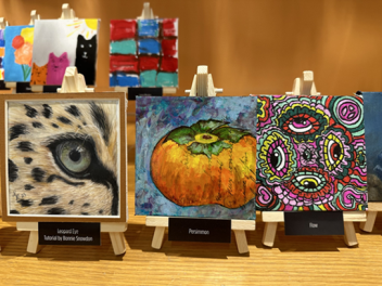 Tiny artwork pieces fill display cases