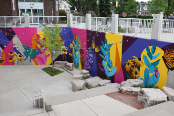 The Friends of St. Charles Public Library commissioned two local artists to create a mural on the outside walls of the Library's terrace garden. A dedication ceremony was held upon completion, where patrons and guests could view the beautiful, vibrant design (as well as tribute plaques with names of loved ones).