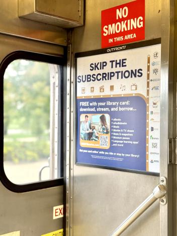 An ad displays at the entrance of a Metra train