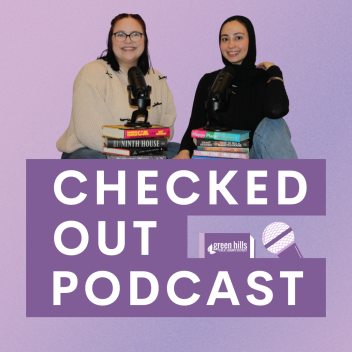 Photo of podcast hosts with stack of books and microphone