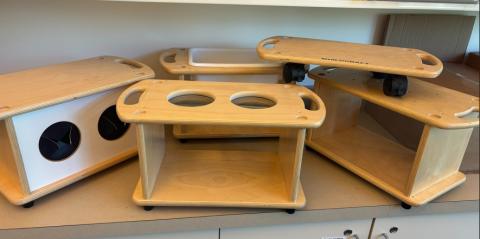 4 wooden activity boxes and tray with wheels